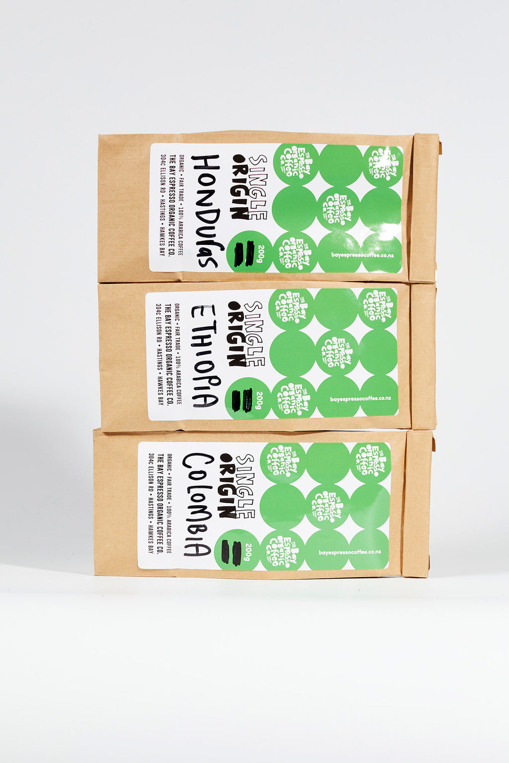 Bags of Bay Espresso single origin Honduras, Ethiopia and Colombia coffee, stacked