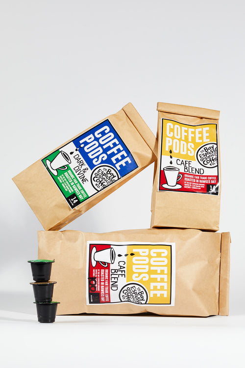 Bags of Bay Espresso coffee pods with three pods in front