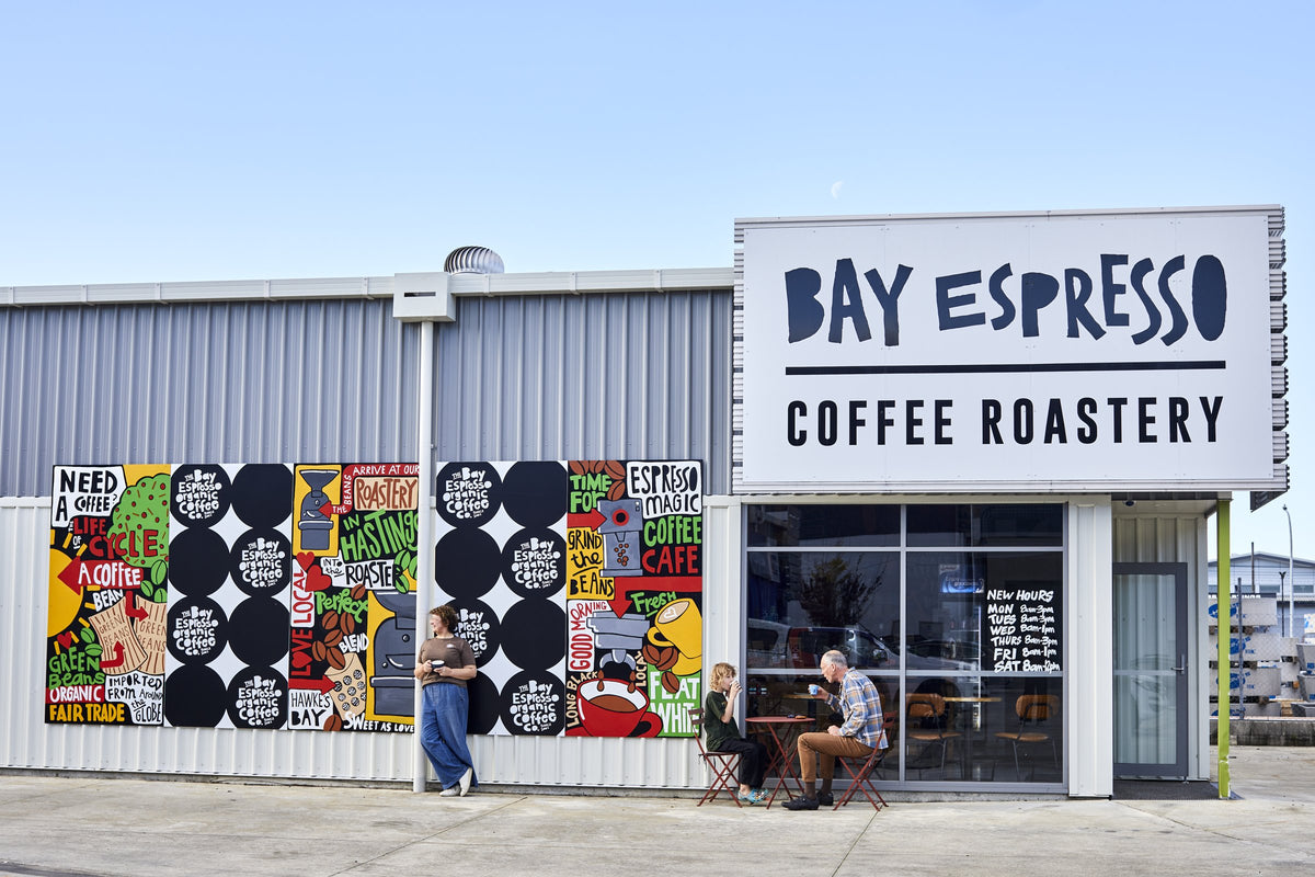 The Bay Espresso roastery on Ellison Road, Hastings, with Jonelle's painted mural beside the shopfront and sign